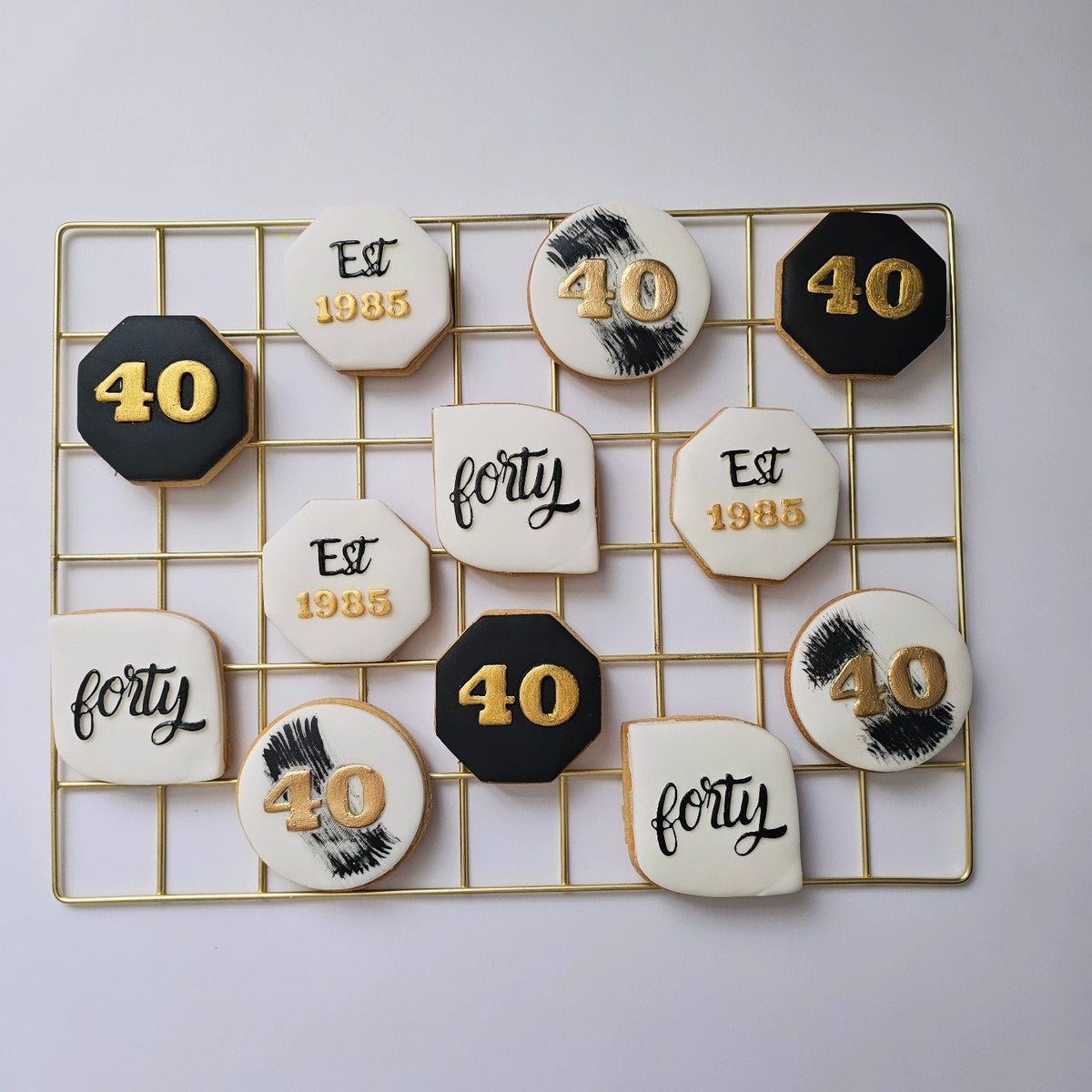 Black and gold 40th birthday biscuits