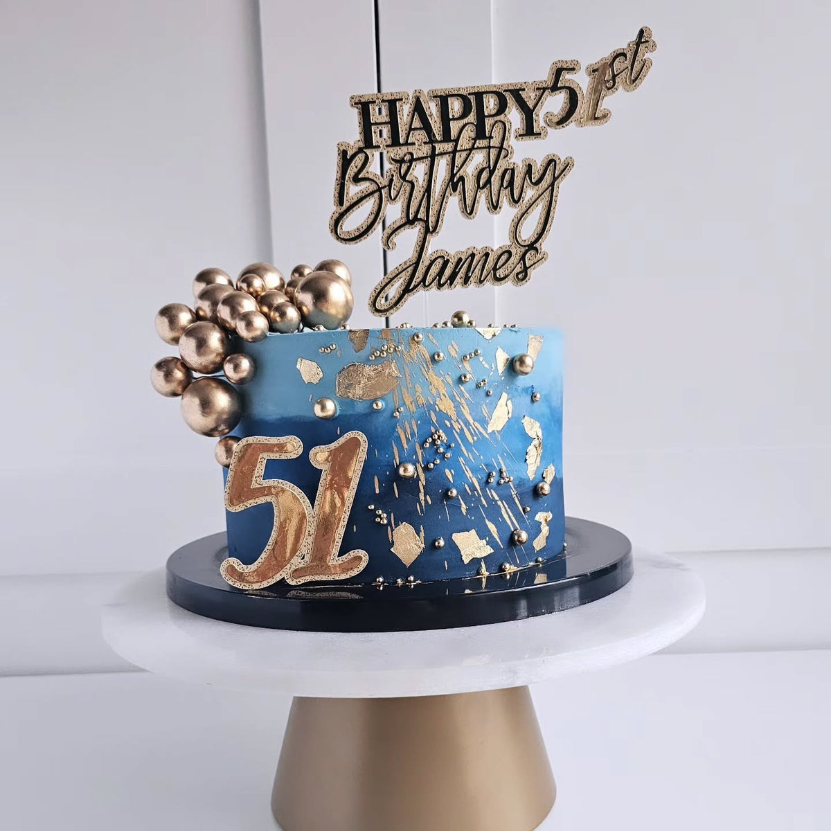 Blue and gold foil birthday cake