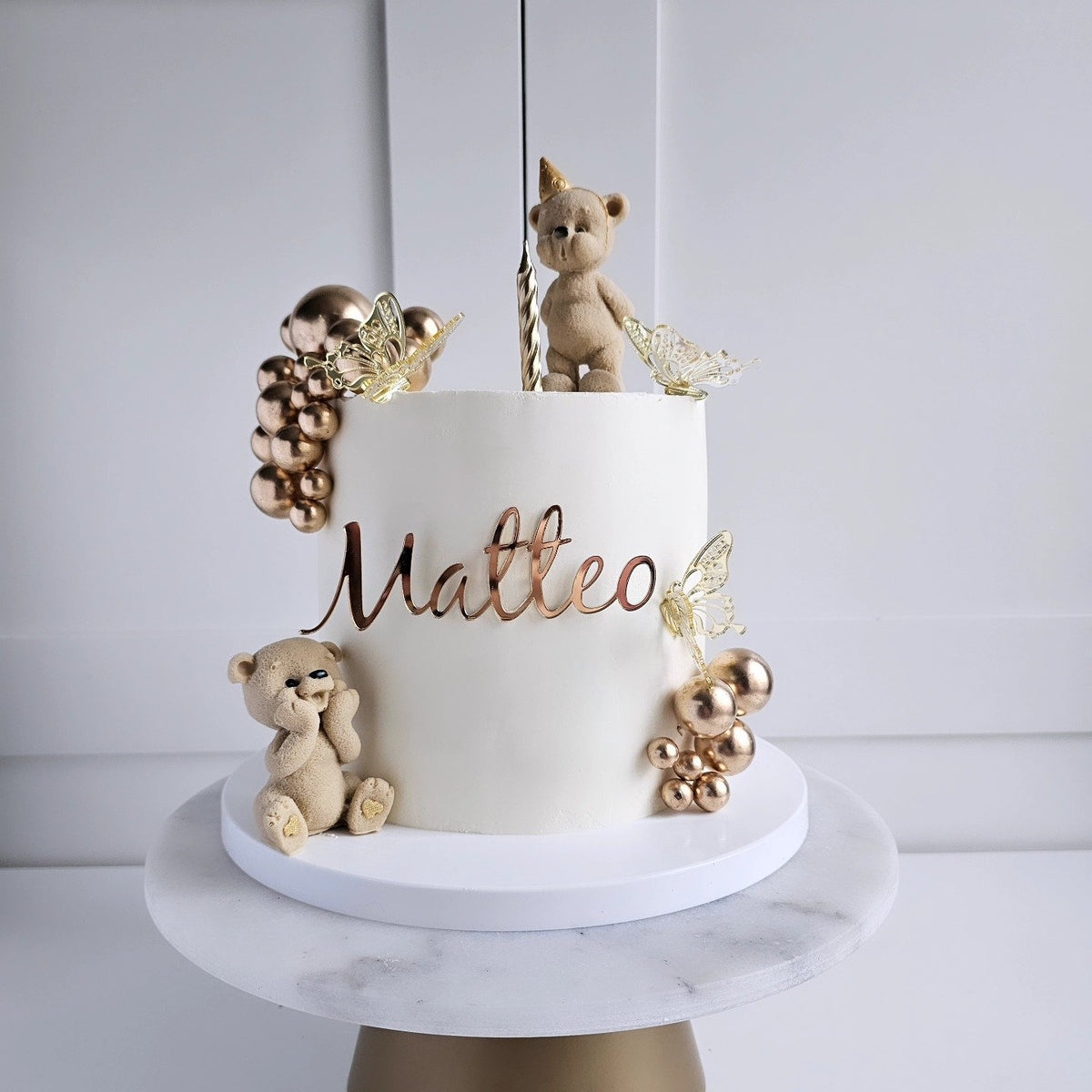 Cream and gold teddy bear cake