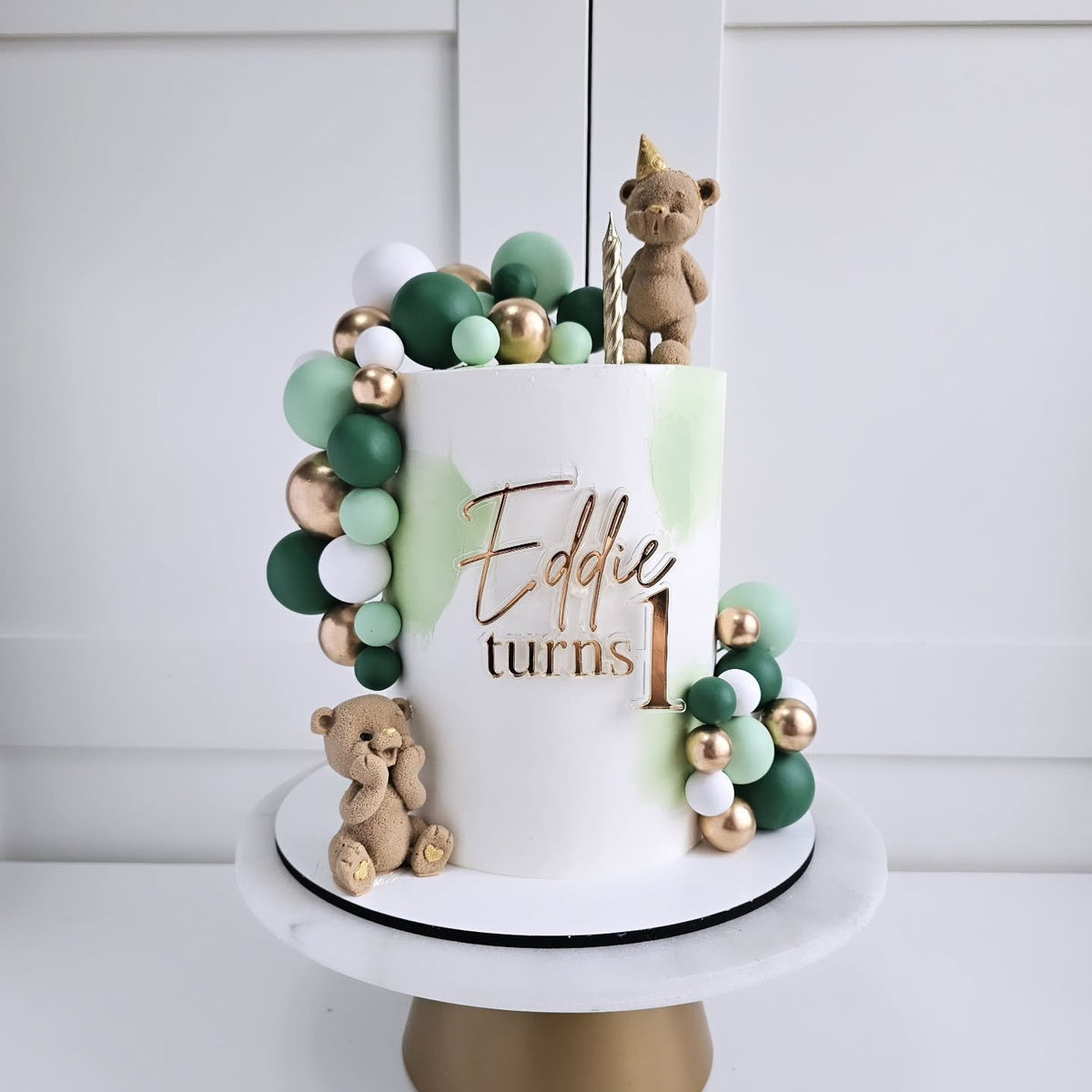 Green and gold teddy bear cake