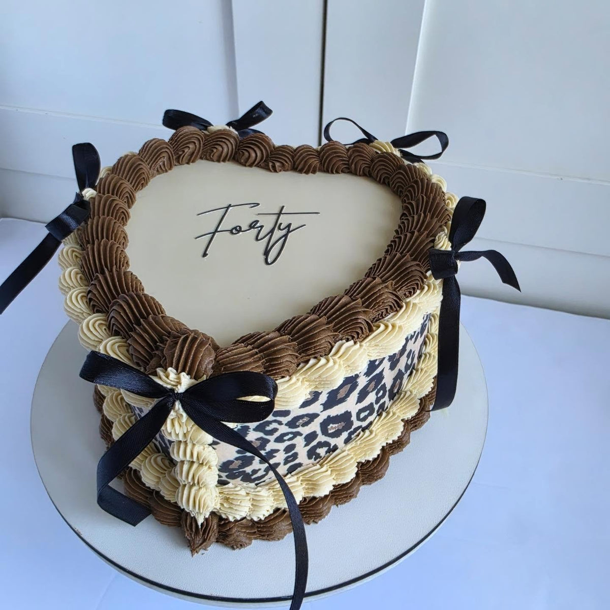 Leopard print heart cake with bows
