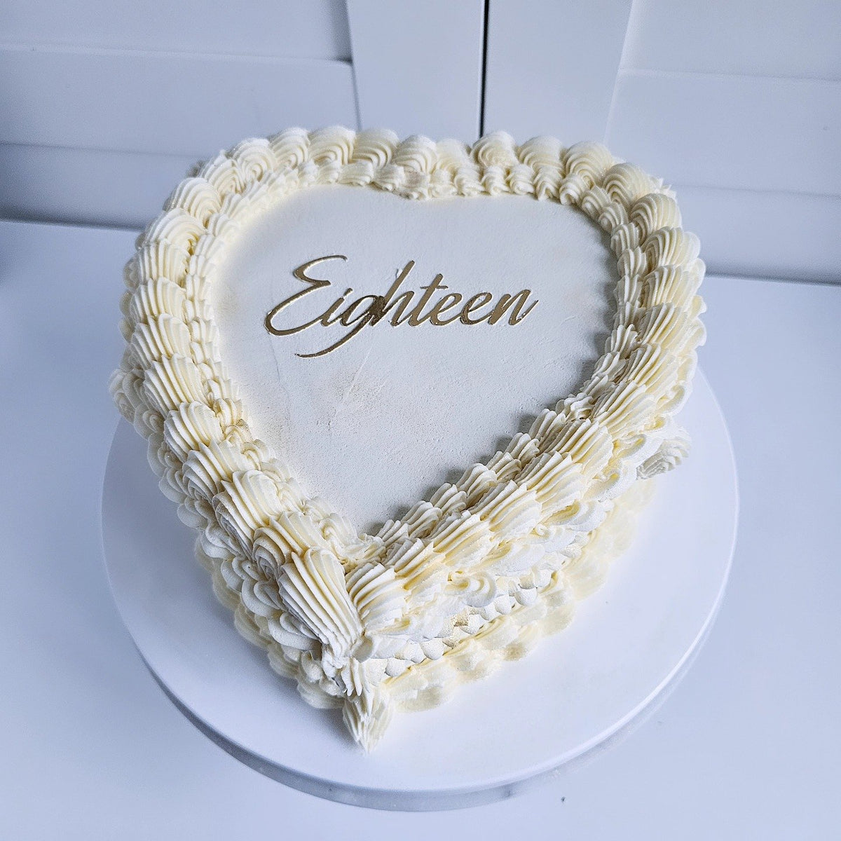 Off-white and gold 18th heart cake
