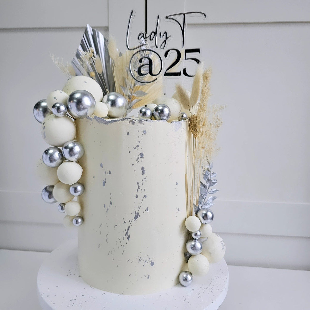White and silver 25th birthday cake
