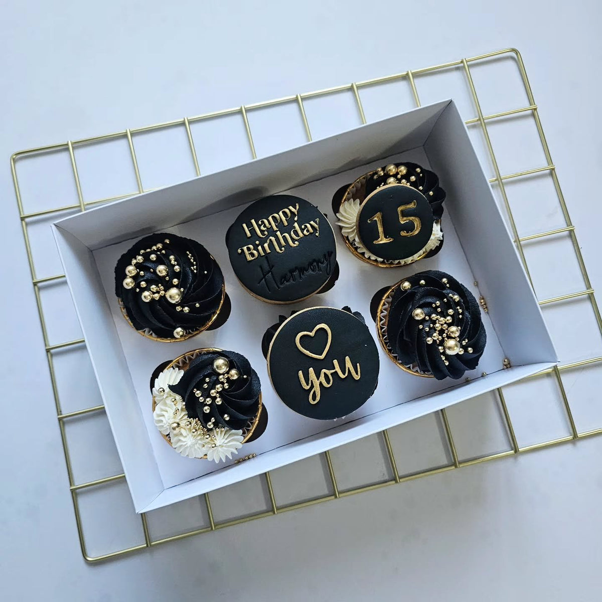 Black and gold birthday cupcakes