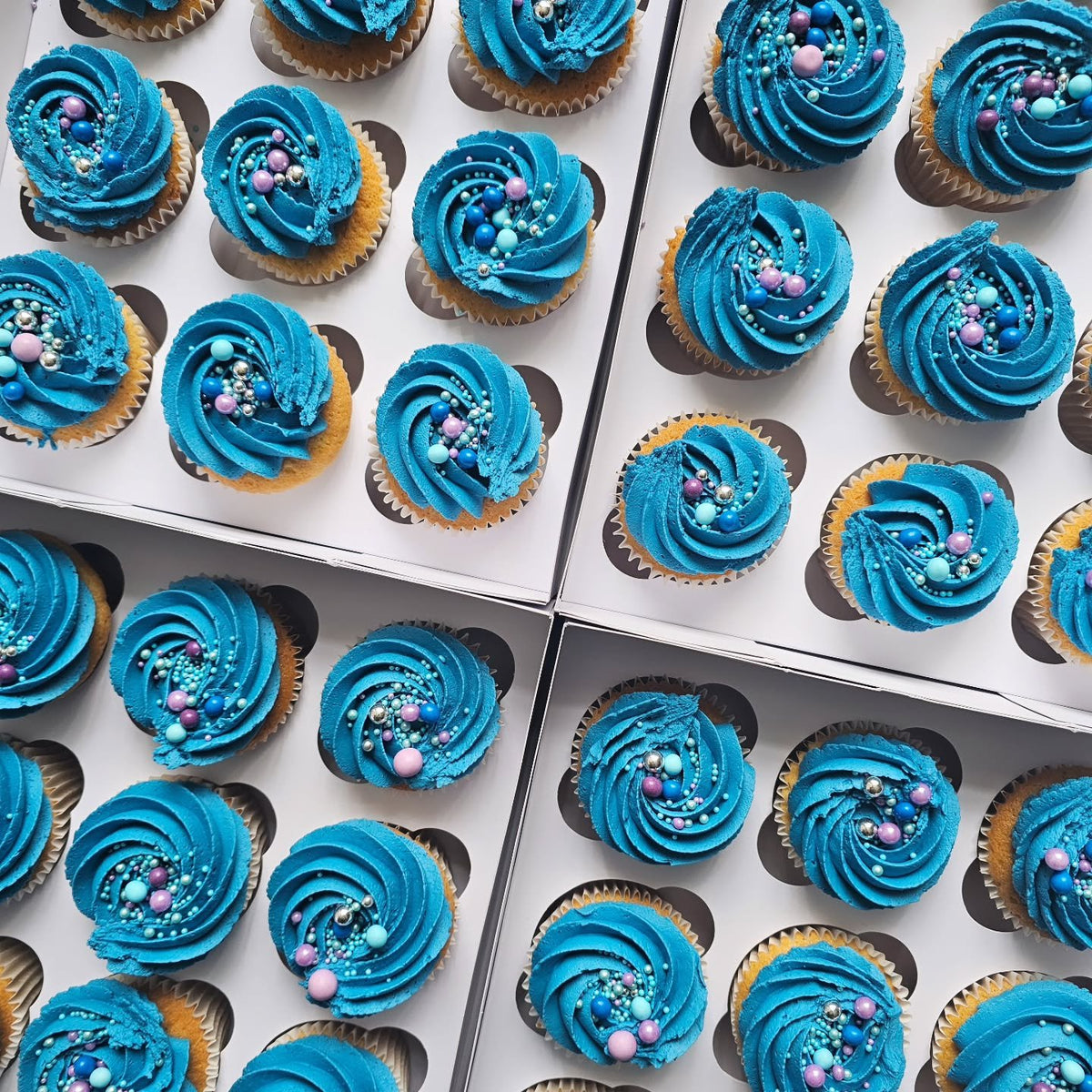 Blue birthday cupcakes with sprinkles