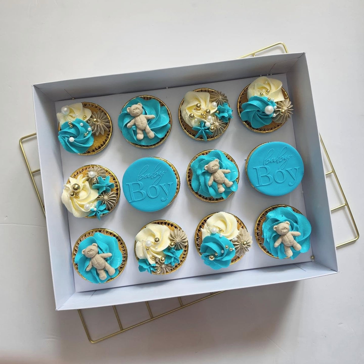 Blue teddy baby shower cupcakes