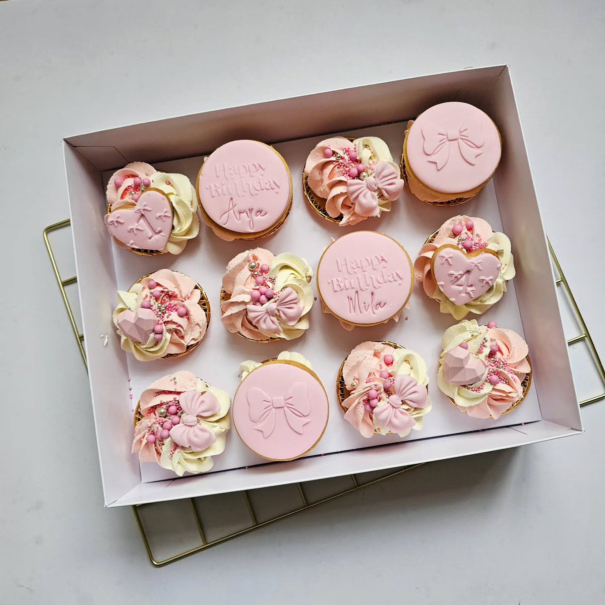 Pink bow cupcakes and biscuits
