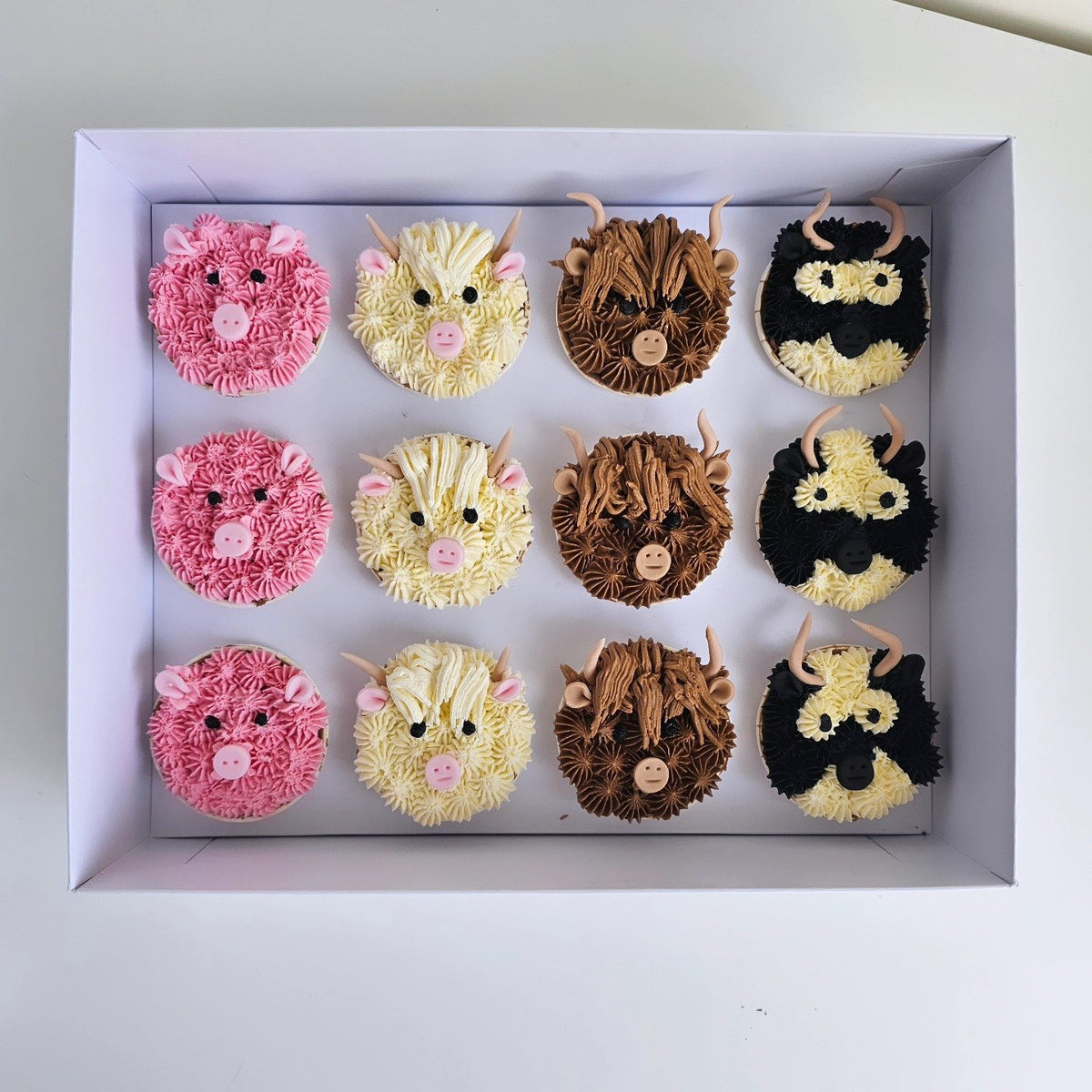 Piped farm animal cupcakes