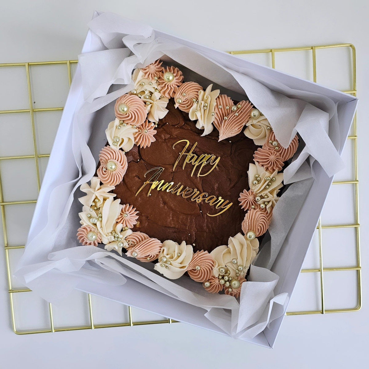 Dusky pink and gold anniversary brownie